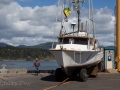 Fishing boat being hoisted onto dry dock at Port Orford