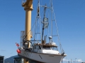 Fishing boat being hoisted onto dry dock at Port Orford