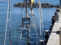 Fishing boat being hoisted onto dry dock at Port Orford