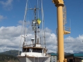 Fishing boat being hoisted onto dry dock at Port Orford