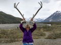 Kim trying on antlers for size at Toklat River - Denali NP