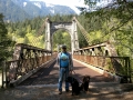 Jerry & pups at the Old Bridge (1926) in Fraser River Gorge, near Hope, British Columbia