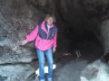 Kim in giant hollow driftwood log on First Beach