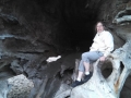 Mom in giant hollow driftwood log on First Beach
