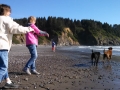 Mom & Kim playing with the pups on First Beach